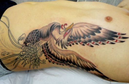 tatuagem masculina na costela animal
