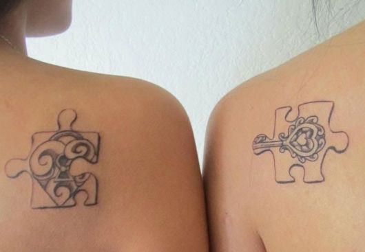 tatuagem mãe e filha qurbra cabeça