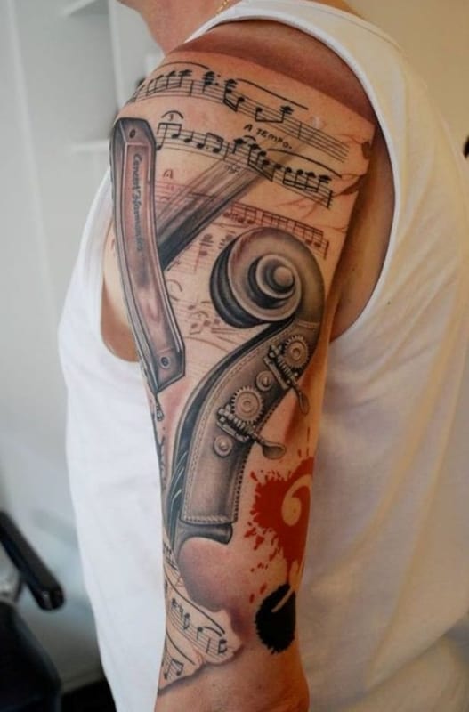 tatuagem de música no braço grande