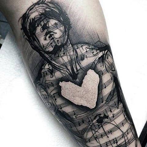 tatuagem de música no braço