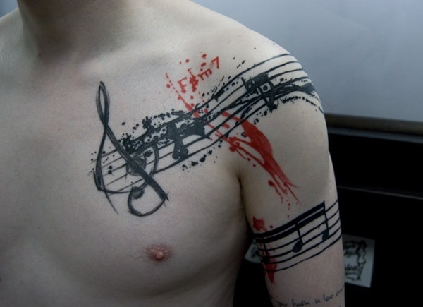 tatuagem de símbolo de música no braço