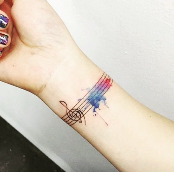 tatuagem de símbolo de música no pulso 1