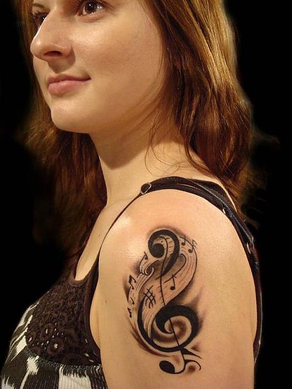 tatuagem de símbolo de música sombreada