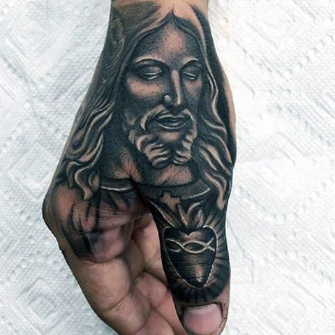 tattoo de Jesus na mão