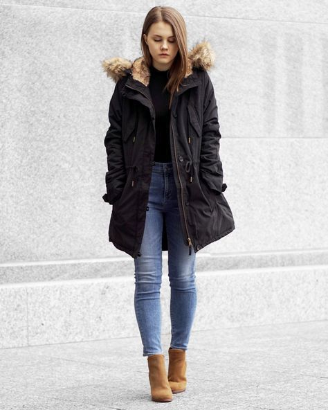 look de inverno com calça jeans e casaco preto