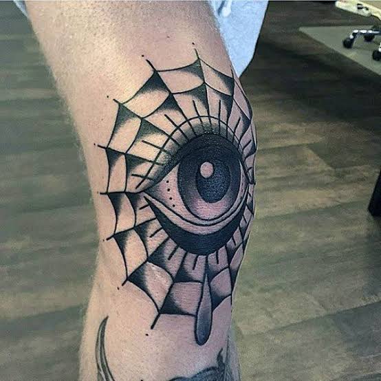 Tatuagem masculina no joelho olho