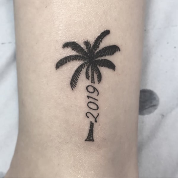 tatuagem de coqueiro no braço