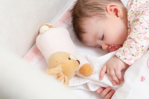 baby girl sleeping with toy rabbit and pacifier picture id466471987