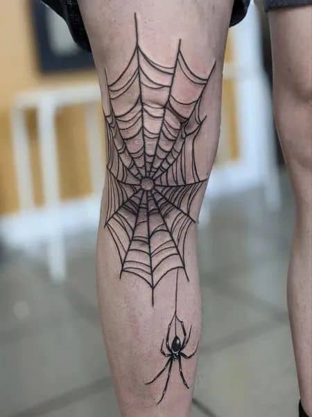 tatuagem de aranha linda na perna